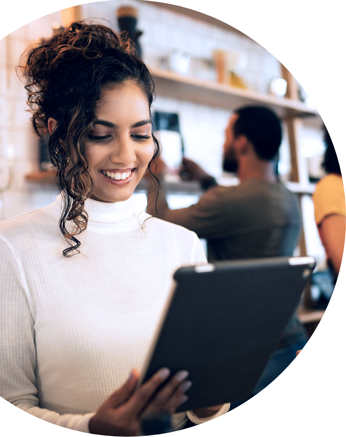 Smiling retail merchant managing transactions on tablet in store
